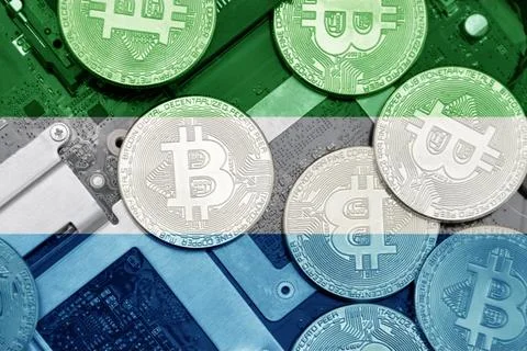 Flag of sierra leone on the bitcoins with computer electronic circuit board.. Stock Photos