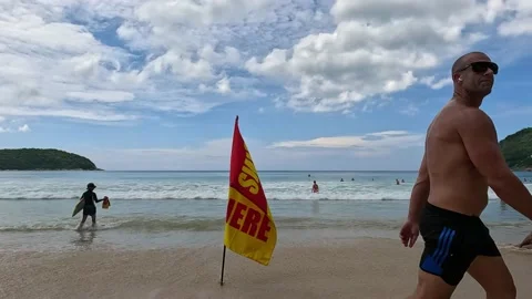 Flag with sign swim here at the beach Stock Footage 220323722