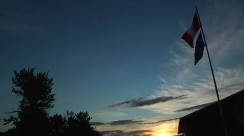 Flag Silhouettes at Sunrise Stock Footage 8652739