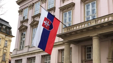 Flag of Slovakia waving in the wind on the building of City Hall in Bratislava Stock Footage 86293298