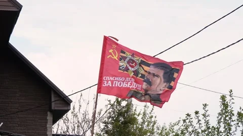 Flag of the soviet union with a portrait . 4k footage. moscow russia 9 may 2024 Stock Footage 280380357