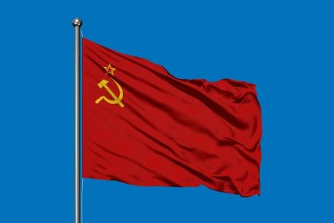 Flag of Soviet Union waving in the wind against deep blue sky. USSR Flag. Фото