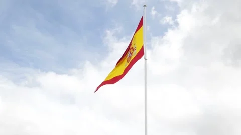 Flag of Spain against cloudy sky Stock Footage 143464261