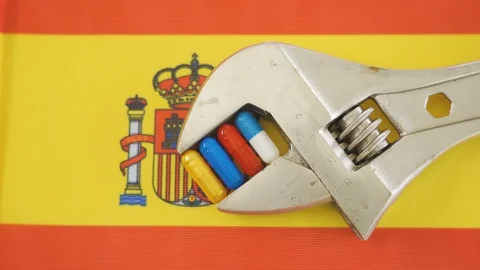 The flag of Spain and the four capsule medicines Stock Footage 129339535