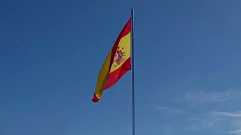 Flag of Spain on a blue sky 스톡 동영상 252445529