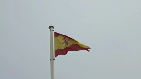 The flag of Spain is drawn from the wind on a flagpole on a white background. Stock Footage 220767280