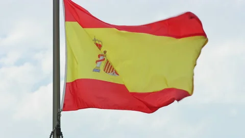 Flag of Spain waves in the breeze on bright cloudy afternoon, slow motion 스톡 동영상 195283102