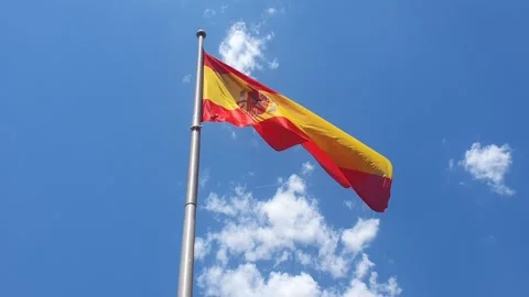 Flag of Spain  waving in wind against cloudy sky. National flag of Spain  flutte Stock Footage 240843033