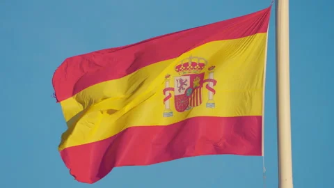 Flag of Spain waving in the wind, sky background. Slow Motion Stock Footage 261971137
