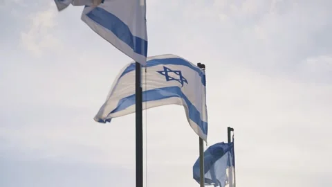 Flag of the State of Israel blowing in the wind on flagpole in Jerusalem Stock Footage 253108609