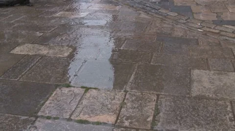 Flag stones rain hitting large paving stone Stock Footage 7151067