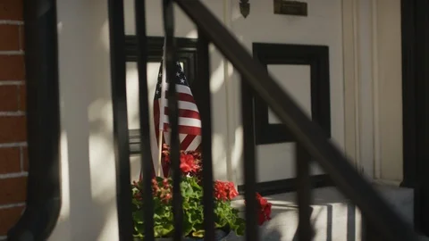 Flag on sunny stoop. Video stock 102789002