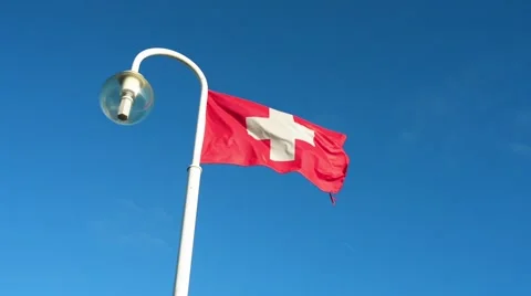 Flag of Switzerland flying on flagpole Stock Footage 65530407