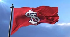USA - NEW YORK, 12 August 2018: Waving flag with St. Louis Cardinals  professional team logo. Close-up of waving flag with Baseball St. Louis  Cardinals club logo, seamless loop. Editorial footage –