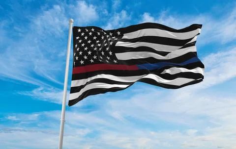 Flag of Thin red and blue Line USA Flag at cloudy sky background on sunset, p Stock Illustration
