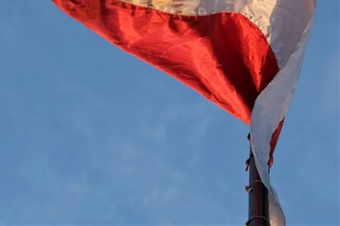 Flag on top of a flying pole Photos