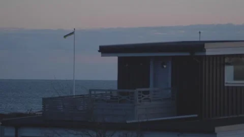 Flag of tradition: experiencing the richness of a typical swedish coastal Stock Footage 245777148