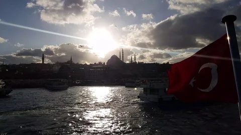 The flag of Turkey flies in the Bosphorus Stock Footage 129808663