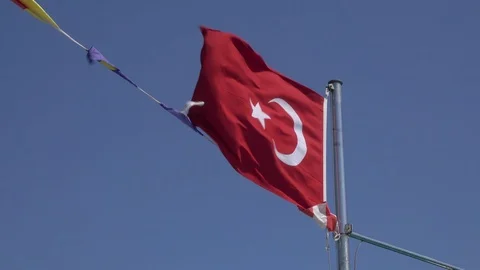Flag of Turkey fluttering in the wind against a blue sky Stock Footage 113145512