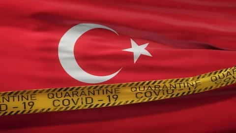 Flag of Turkey waving on wind with Covid-19 quarantine tape Video stock 127723997