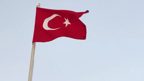 Flag of turkey waving in the wind in front of blue sky Stock Footage 340164630