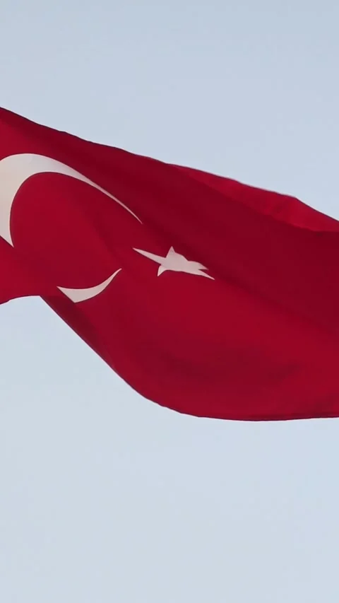 Flag of turkey waving in the wind in front of blue sky Stock Footage 340389096