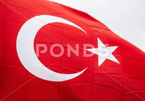 Flag of Turkey waving in the wind with highly detailed fabric texture Stock Photos