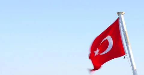 Flag of Turkey. Waving in the wind. View from the back of a ferryboat. Stock Photos