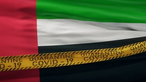 Flag of UAE waving on wind with Covid-19 quarantine tape Stock Footage 127724170