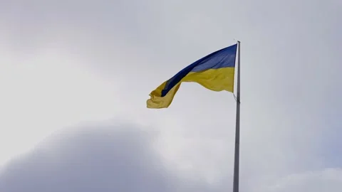 Flag of Ukraine against a cloudy sky. Yellow-blue flag of Ukraine wind waving. 库存影片 217930103