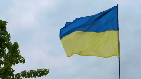 Flag of Ukraine against a dramatic sky. Flag of ukraine slowmotion. War in Stock Footage 201890083