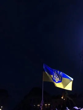 Flag of Ukraine on a background of black sky. Stock Photos