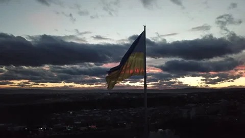 The flag of Ukraine on the background of the sunset. Torn flag. Dramatic scene 스톡 동영상 268323307