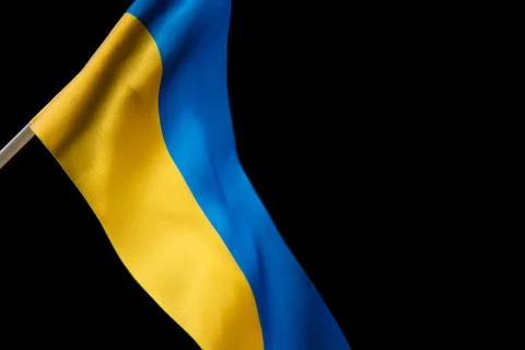Flag of Ukraine on dark background is developing in the wind. Yellow and blue Stock Photos