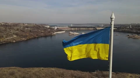 The flag of ukraine is developing in the wind, a view of the dam, the Dnieper Stock Footage 151459617
