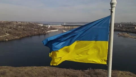 The flag of ukraine is developing in the wind, a view of the dam, the Dnieper Stock Footage 151459657