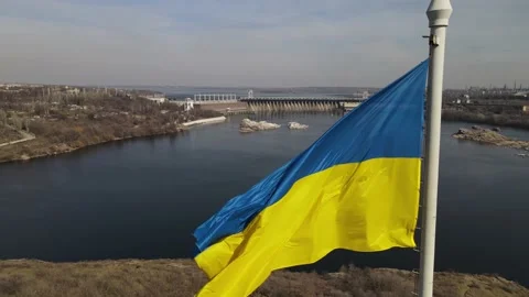 The flag of ukraine is developing in the wind, a view of the dam, the Dnieper Stock Footage 151459774