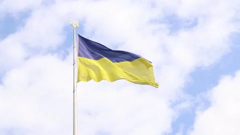 The flag of Ukraine develops in the wind. Torn flag Stock Footage 244746995