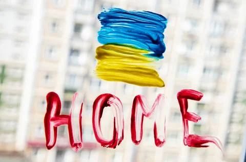 The flag of Ukraine painted on the window Stock Photos