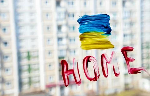 The flag of Ukraine painted on the window Stock Photos
