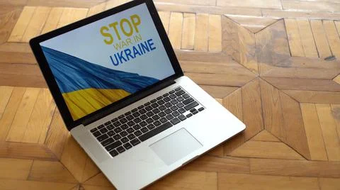 Flag of Ukraine with screen laptop, war in Ukraine, patriot, template, peace in Stock Photos