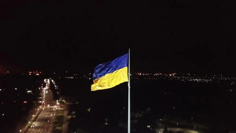 The flag of Ukraine, a silk flag flies against the background of the night sky  Stock Footage 196399207
