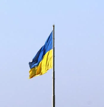 Flag of Ukraine, which flutters in the wind. Stock Photos