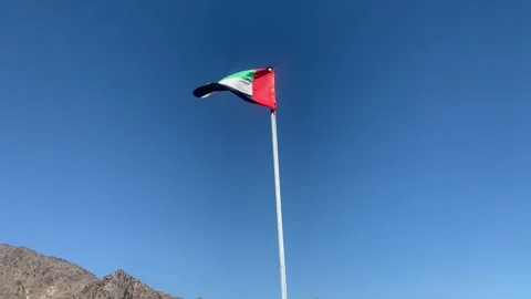 Flag of the United Arab Emirates (UAE) is waving on top of Al Hayl fort Stock Footage 300034026