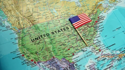 Flag on US map, Macro shot of United States flag situated on geographic Stock Footage 327598065
