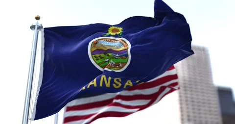 The flag of the US state of Kansas waving in the wind with the American flag Stock-Footage 163290879