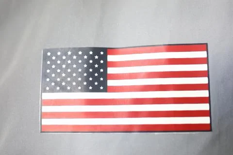 Flag USA patch on silver spacesuit closeup. Stock Photos