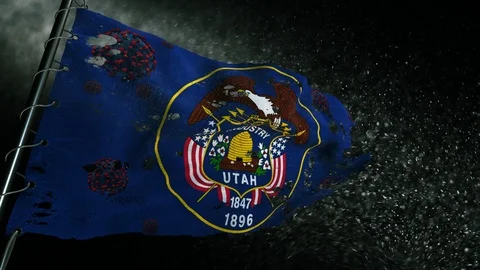 The flag of Utah is torn and marked with the virus of covid-19 . Vídeo Stock 127200398