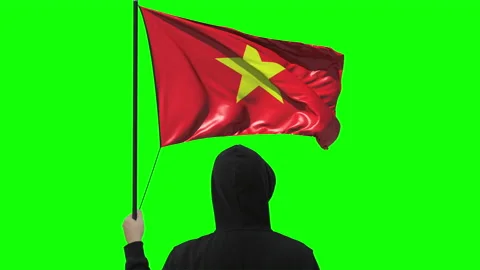 Flag of Vietnam and unknown man, alpha matte Video stock 142802812