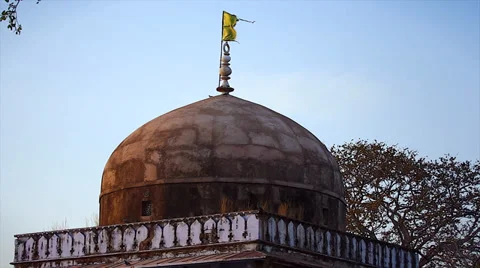 A flag waves in the wind atop Ranthambore Fort in Ranthambore, India. Stock Footage 37519815